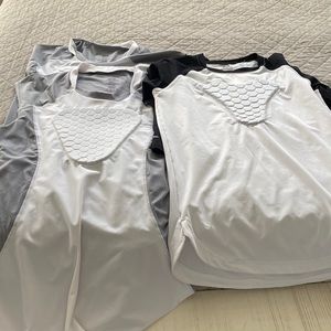 Three McDavid heart guard undershirts